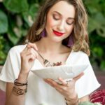httpselements.envato.comwoman-with-healthy-food-on-the-green-wall-backgrou-RK4FTMC-1.jpg